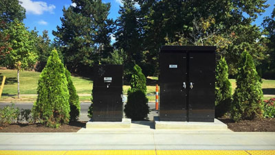 Two commercial meter pedestals sit on the curb in Cleveland, Ohio.